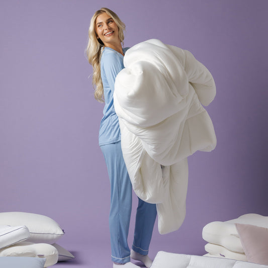 a woman holding a comforter